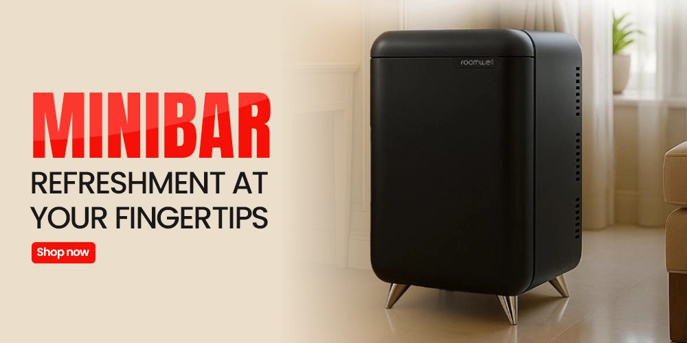 Inviting Roomwell minibar tray with kettle mugs and welcome treats on wood-look shelf